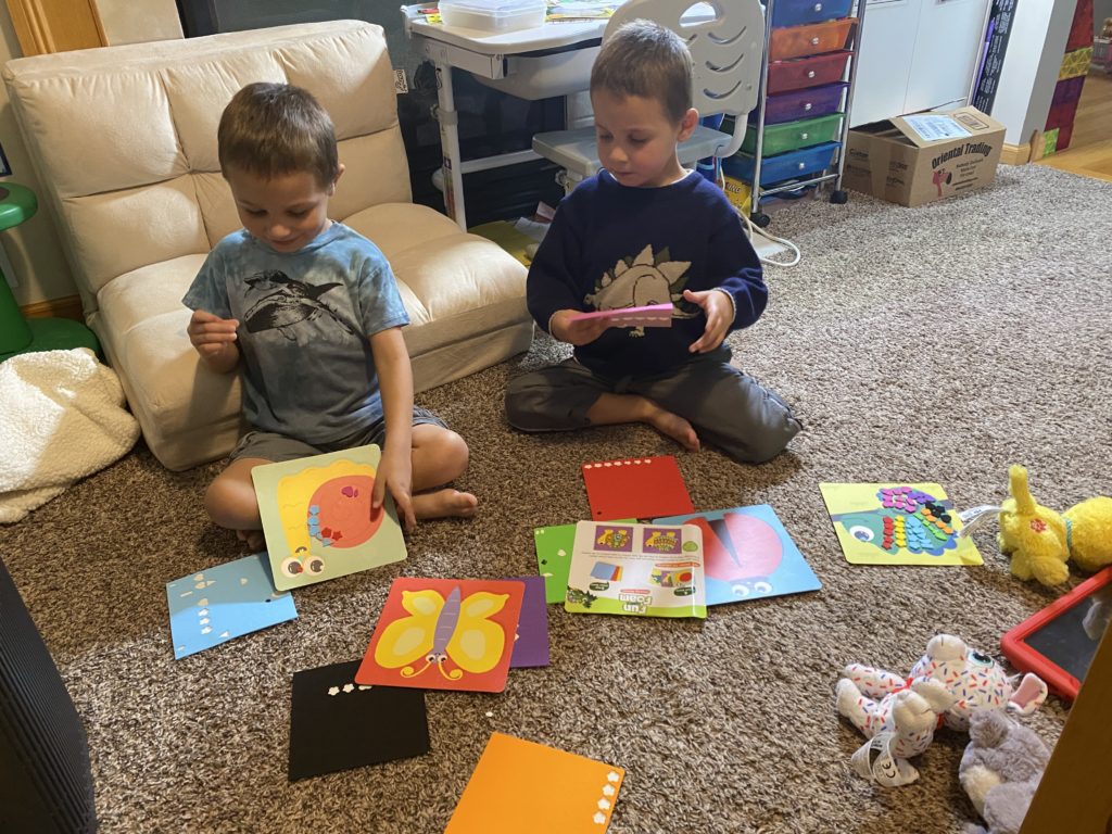 My twins working on their fun with foam animals
